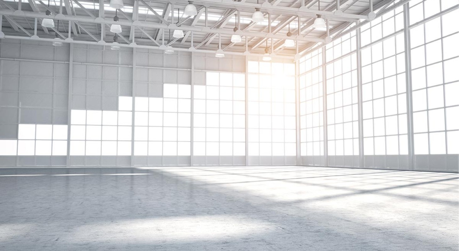 empty modern white warehouse with staggered windows