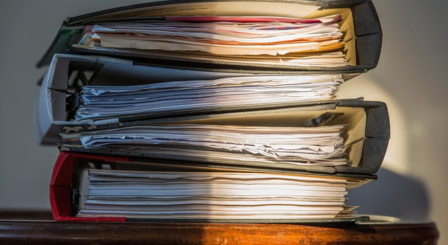 old three ring binders with worn papers