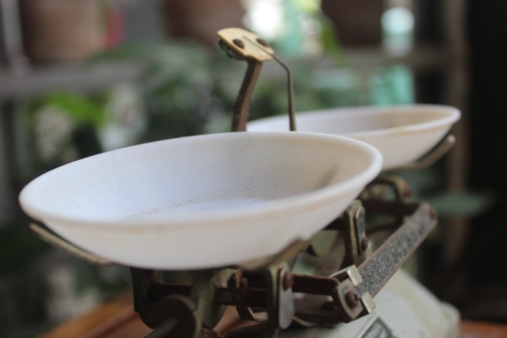 old iron weight scales with white bowls