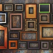 assortment of empty frames of various sizes on bronze wall