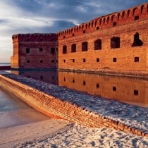 Ocean front fort with brick moat at sunset
