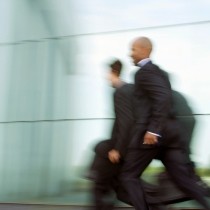 businessmen running
