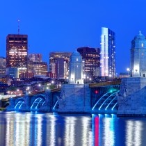 nighttime view of longfellow bridge going into kendall square